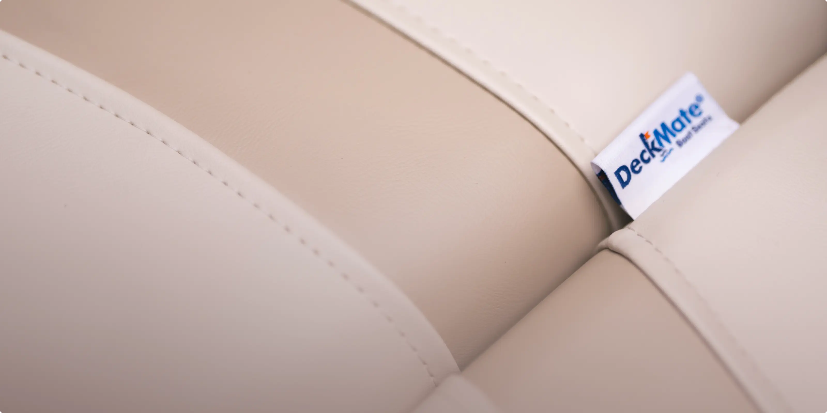 Detail image of Pontoon Boat Seat lining and stitching - Deckmate Brand Tag