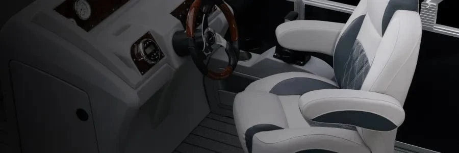 Luxury pontoon captains chair and console with burlwood steering wheel