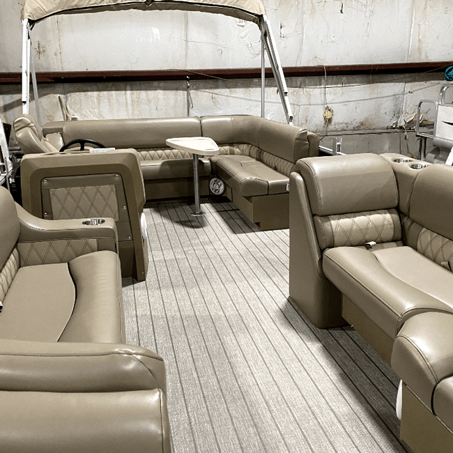 Pontoon boat with luxury beige furniture lean back seats, bench seats, corner seats, console, helm chair, and a table