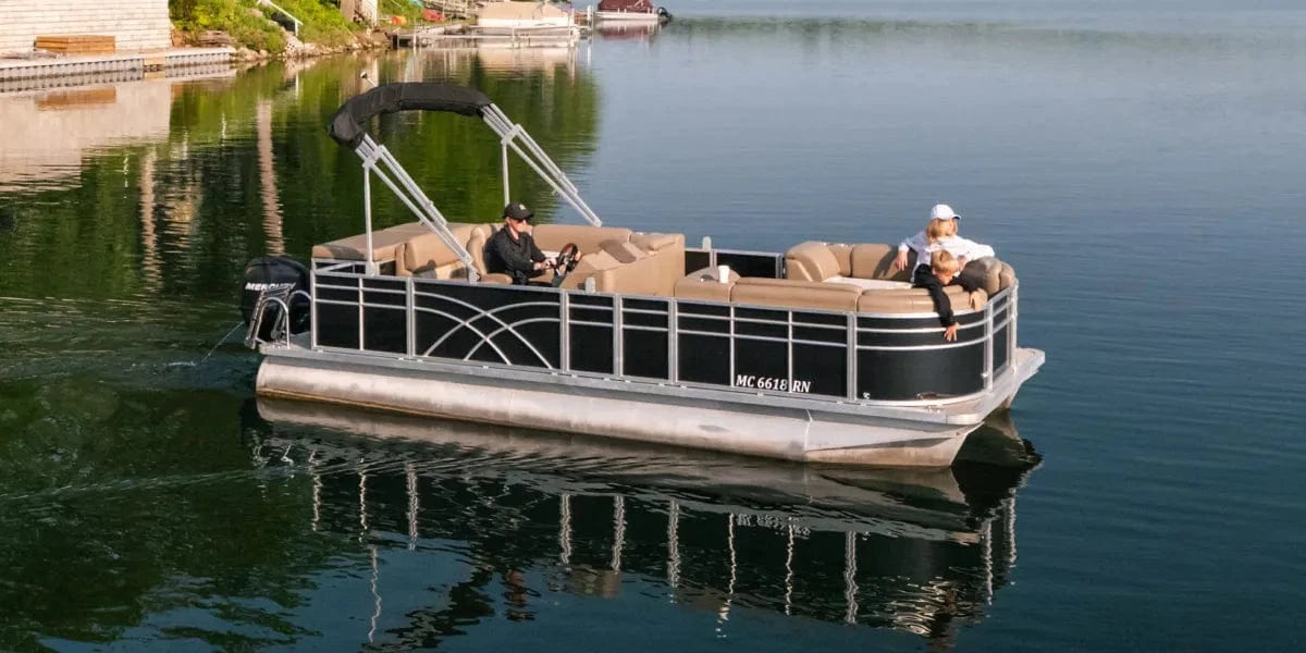 Pontoon boat with luxury furniture and a black stern entry fence