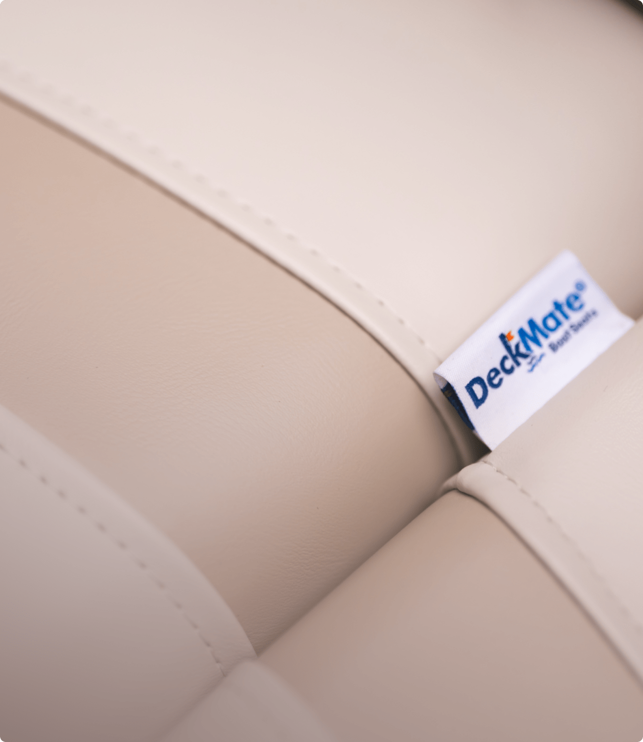 Detail Image of Beige Luxury Pontoon Boat Seat Stitching and Deckmate Tag