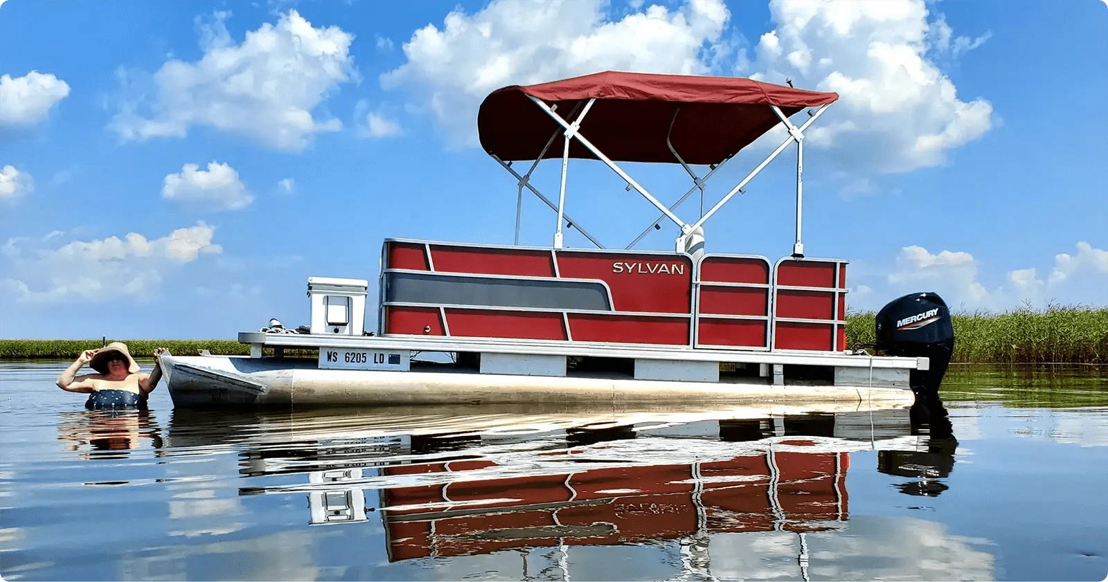 small pontoon boat on the water