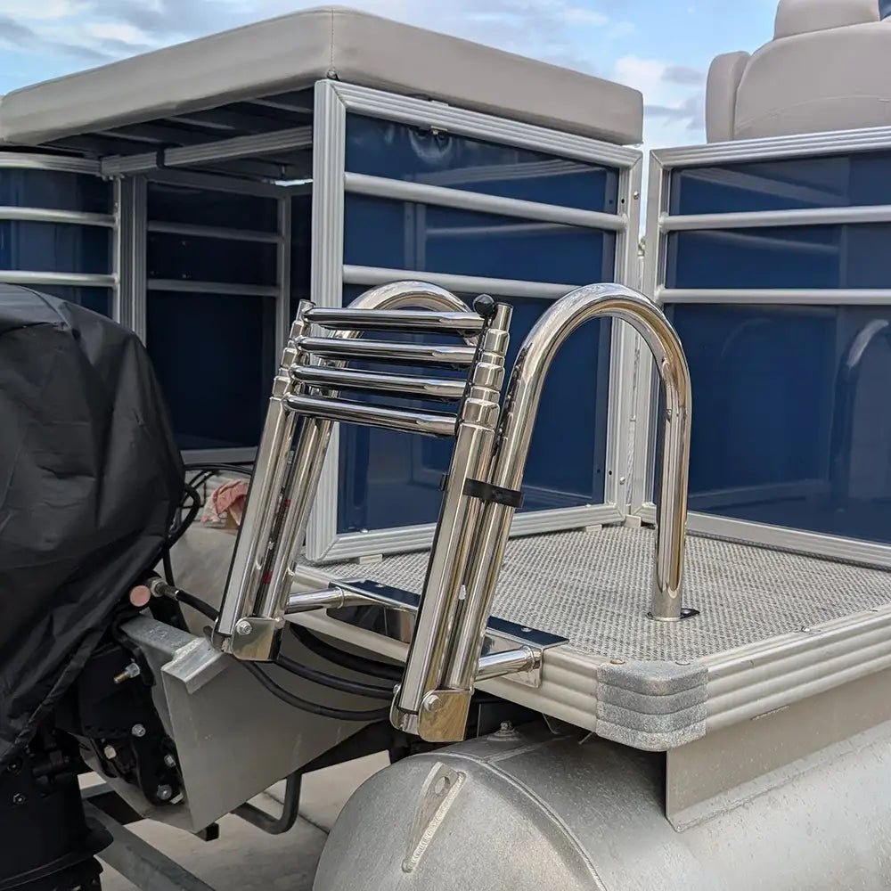 Steel ladder on a boat with a navy stern entry sun deck fencing