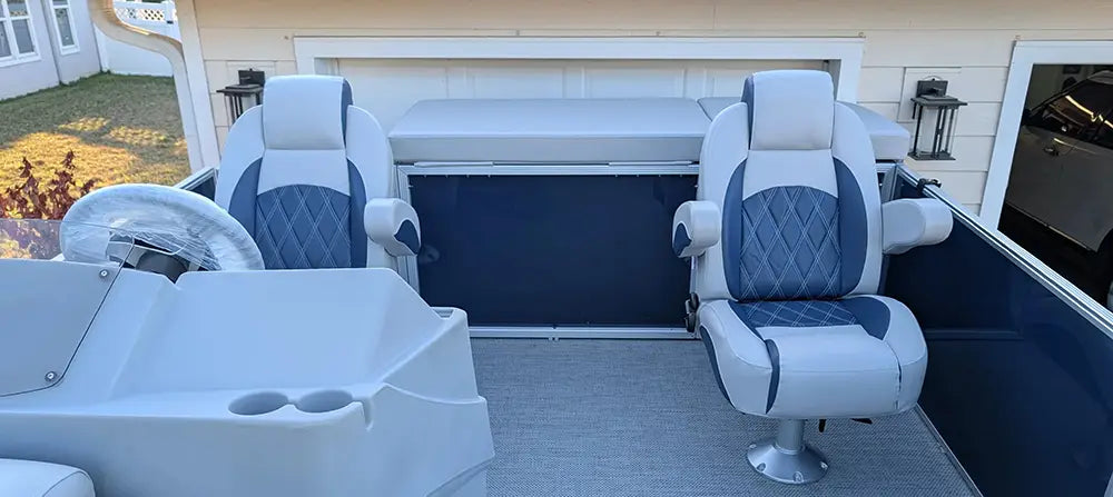 Luxury gray pontoon helm chairs and a console with stern entry sun deck