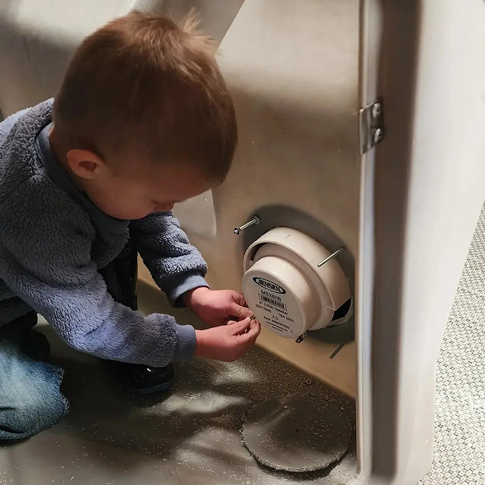 Kid working on pontoon boat