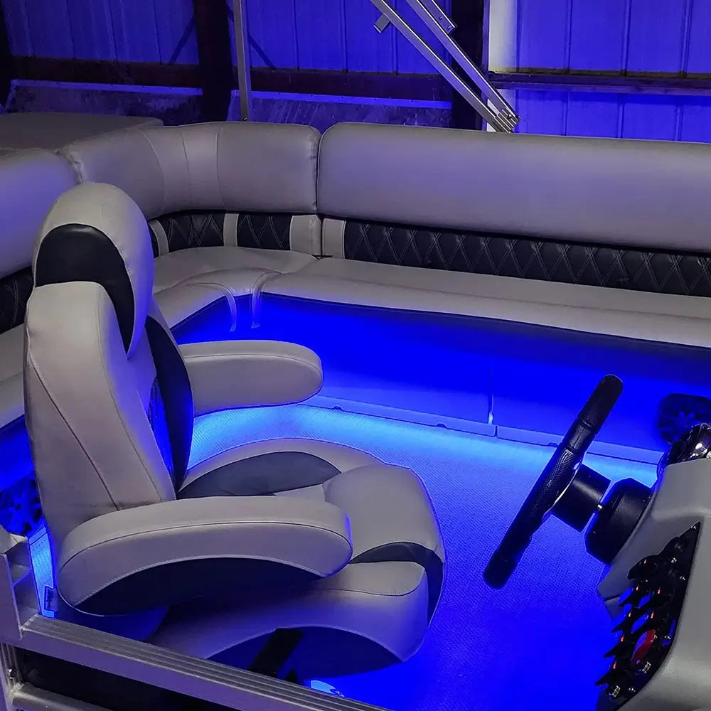 Luxury pontoon furniture with LED Lights and a helm chair, bench seats, and lean backs.